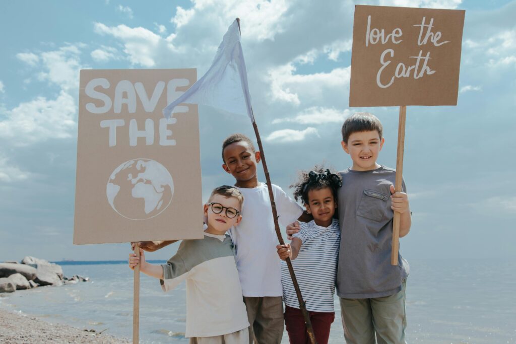 photo/children-standing-together-while-holding-signages